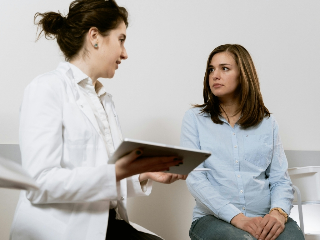A woman talking to her doctor