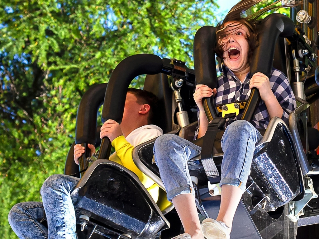 People close up on a rollercoaster